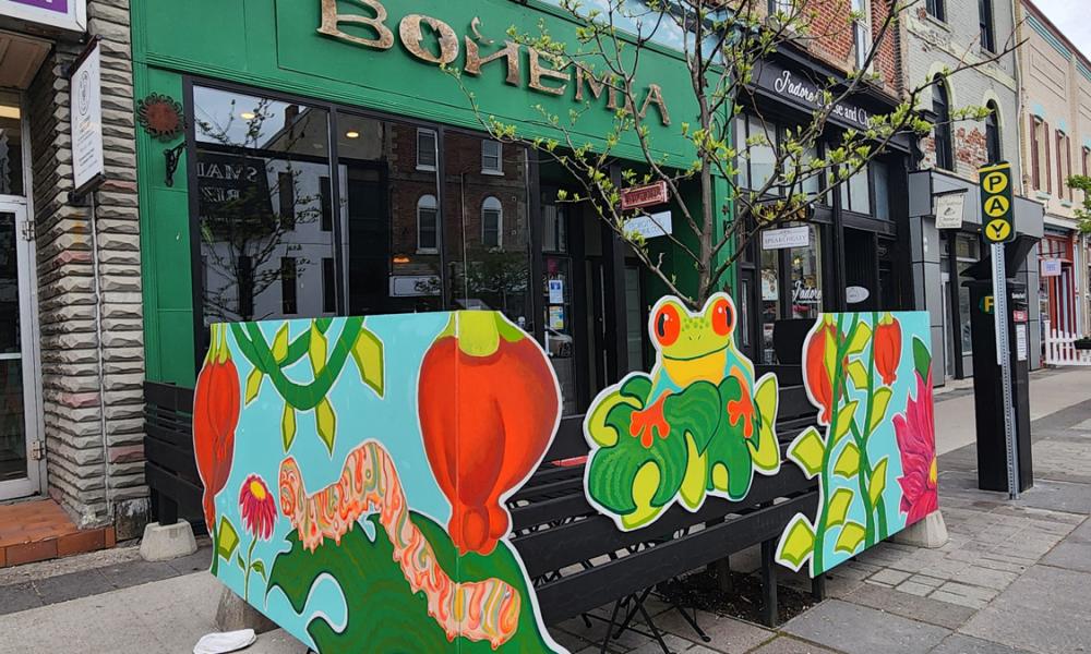 Bright artwork on the patio fencing at Bohemia