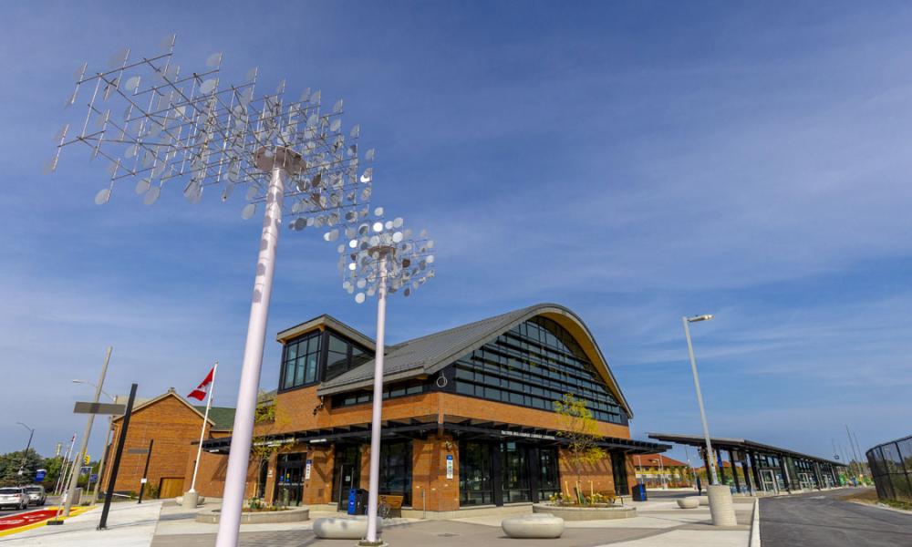 Monumental shimmering, kinetic cloud sculpture with the Barrie Allandale Transit Terminal in the background