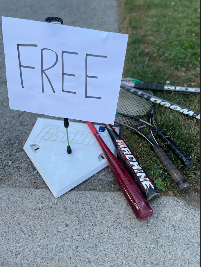 Sports equipment labelled "FREE" at the curb