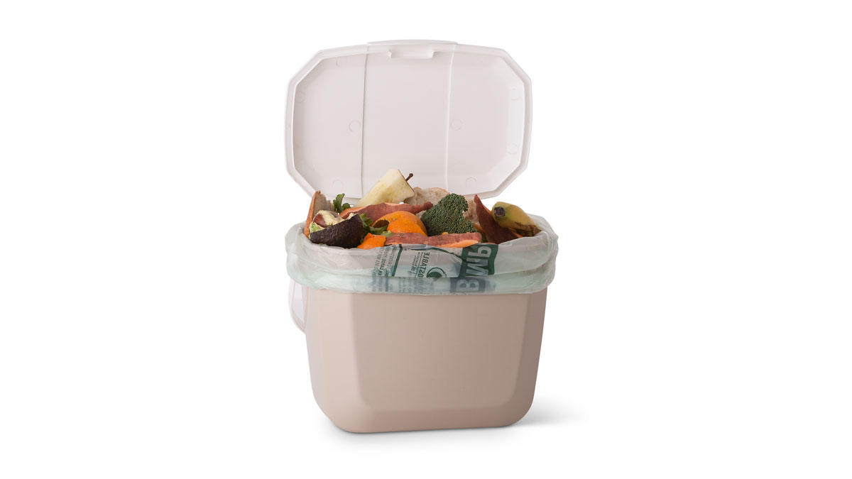 Small bin with ban inside, filled with food