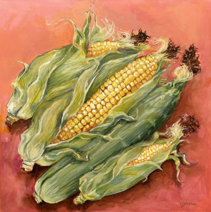 Four ears of corn in green husks set against a warm pink background.