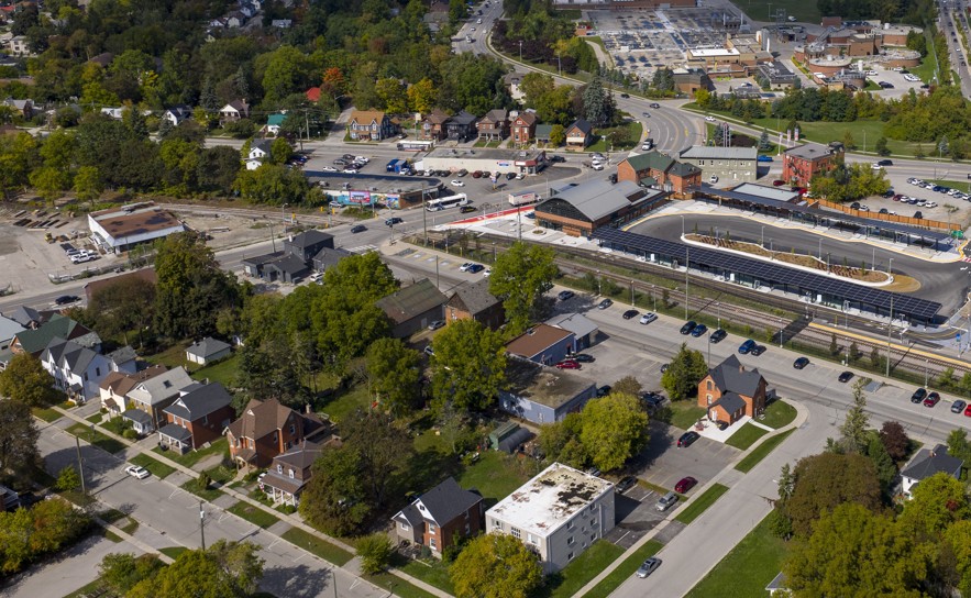 Aerial view of suburban houses and trees.