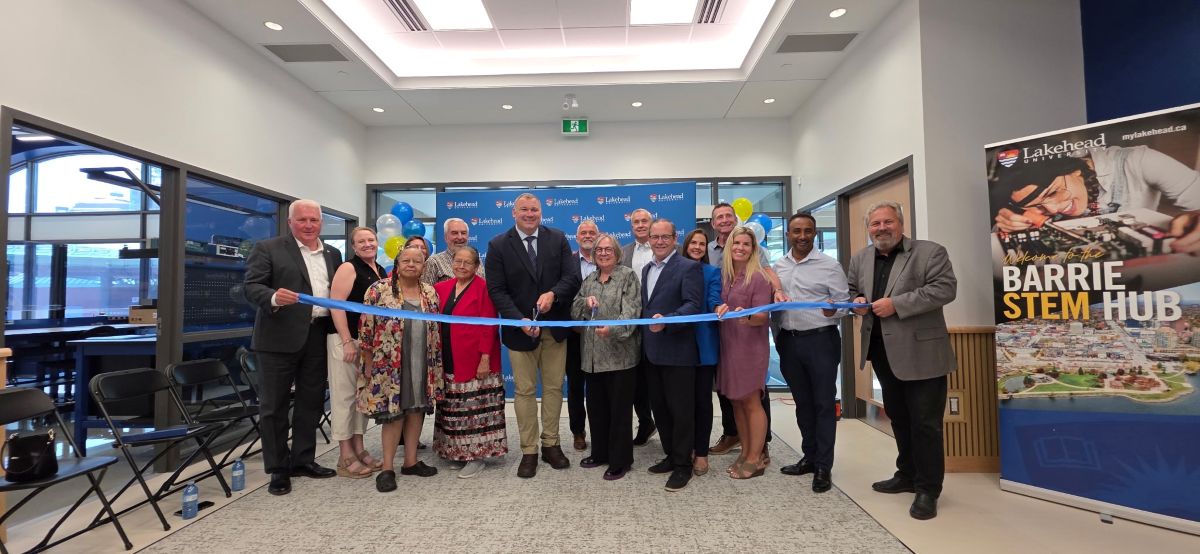 Group of people gathered for a ribbon-cutting ceremony at the Barrie STEM Hub.
