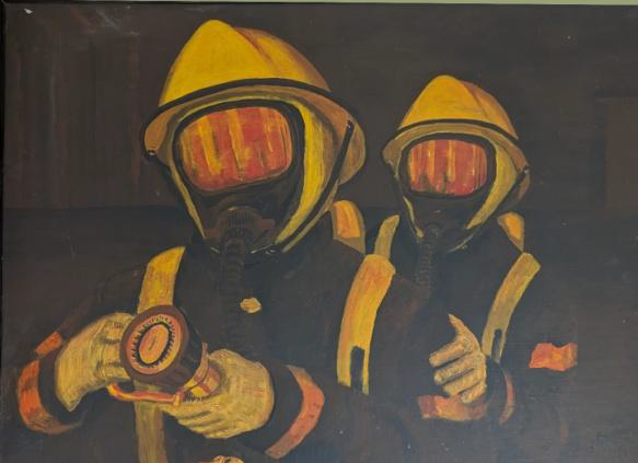 Two firefighters in yellow helmets and masks, one holding a flashlight, in a dark setting.