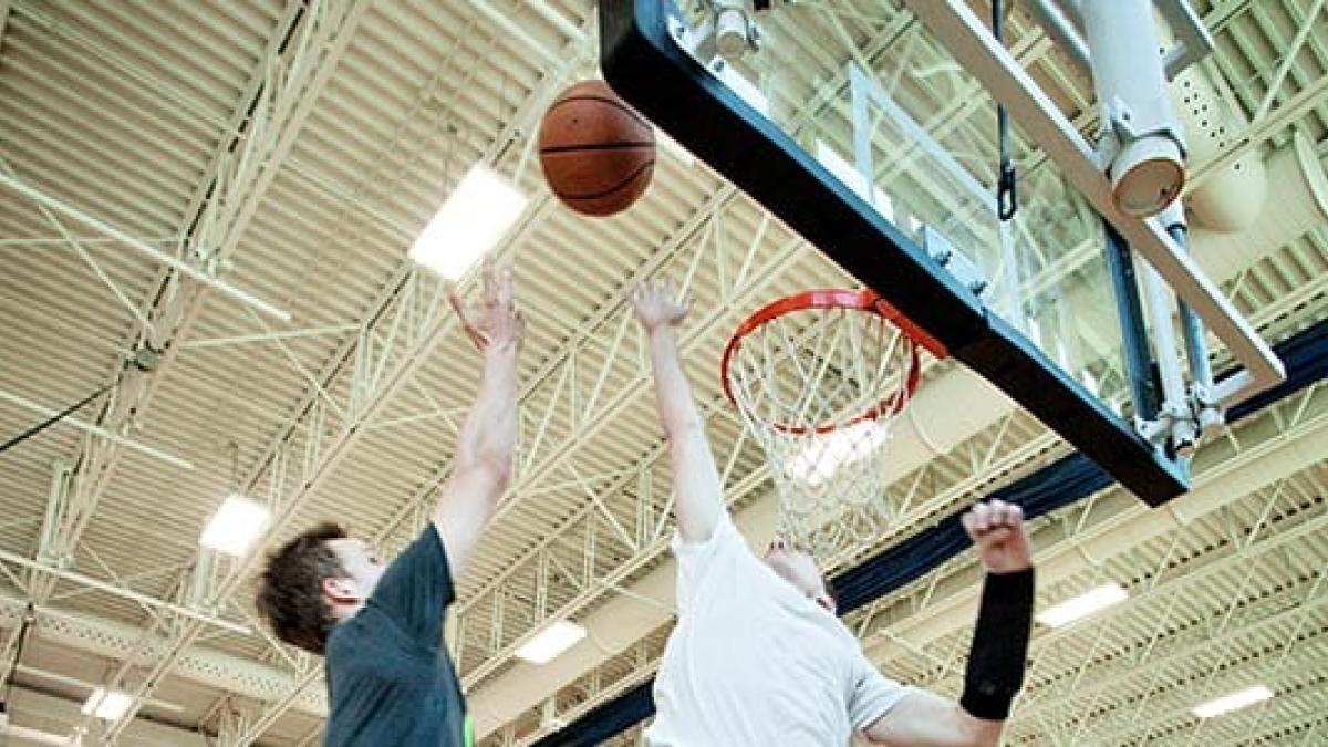 People playing basketball in a gymnasium