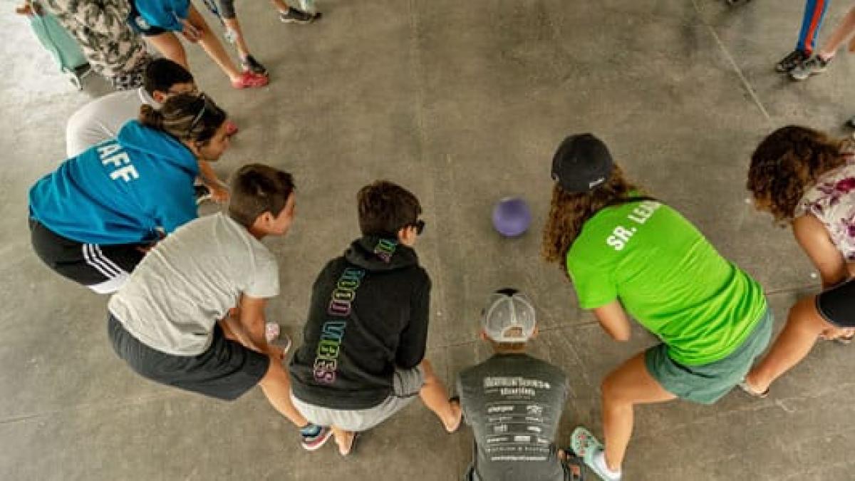 youth playing with ball, viewed from above