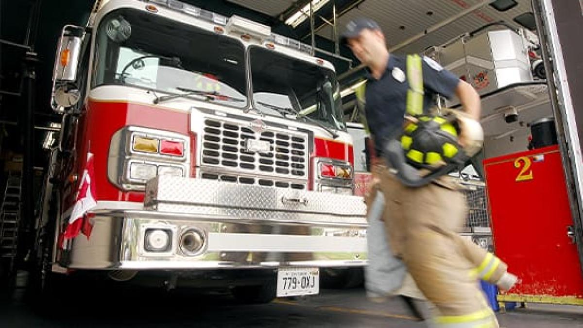 firefighter running near truck