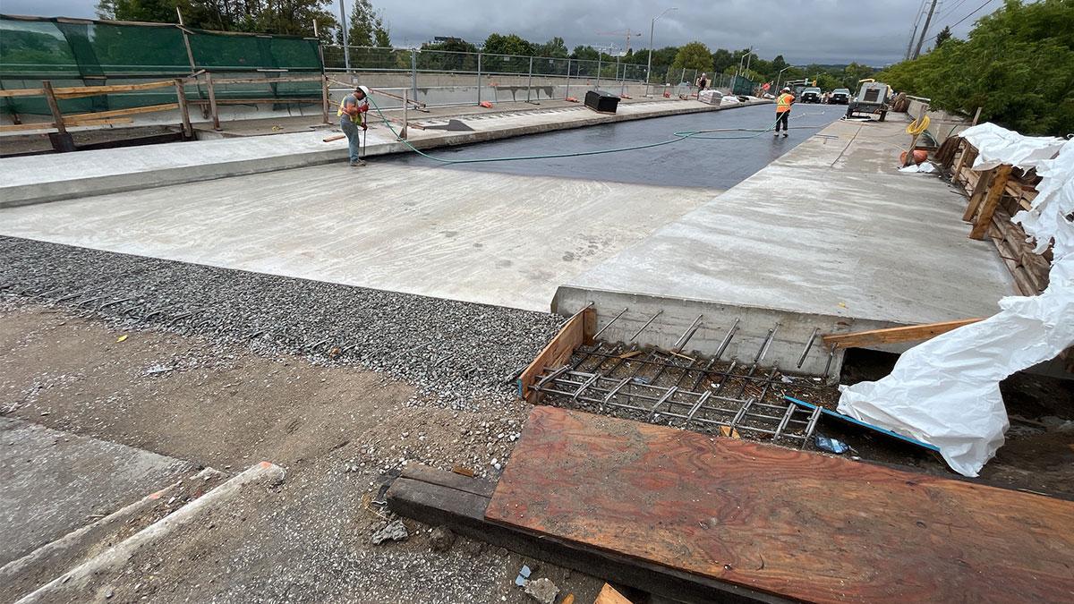 Tack coat being applied to Painswick Bridge ahead of waterproofing