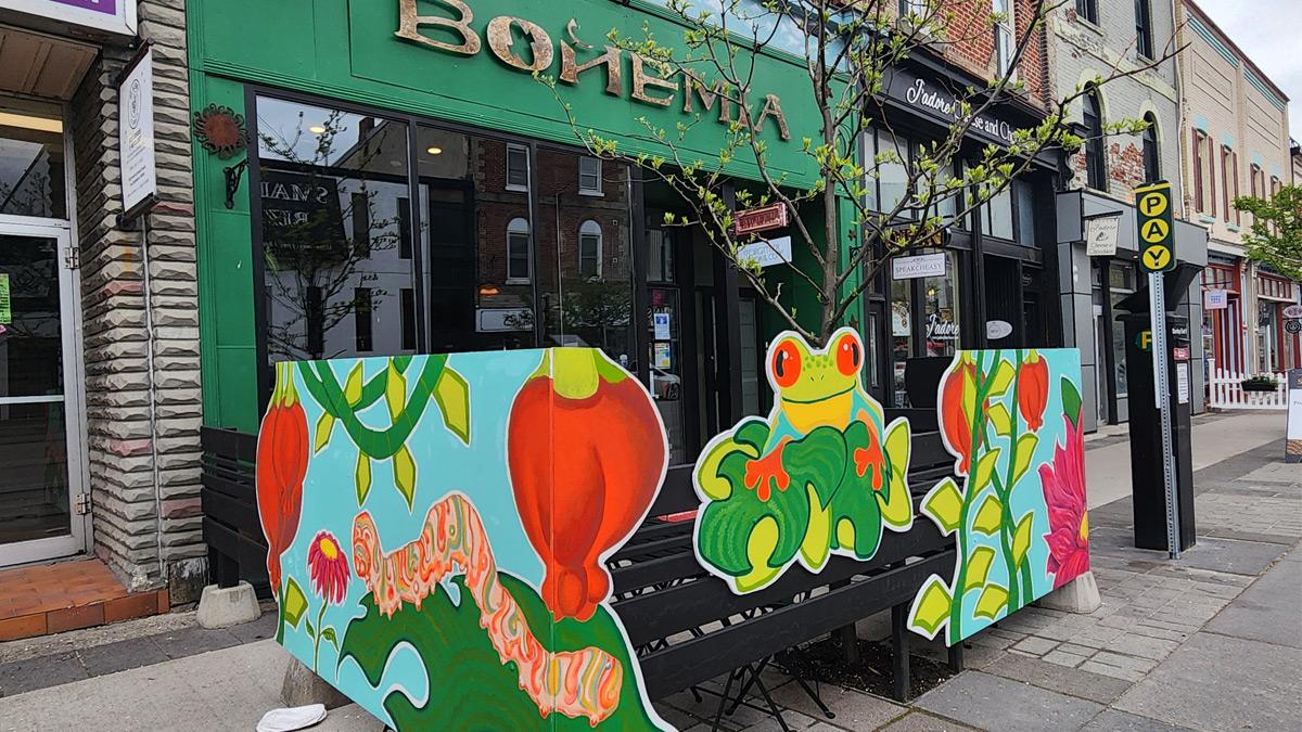 Bright artwork on the patio fencing at Bohemia