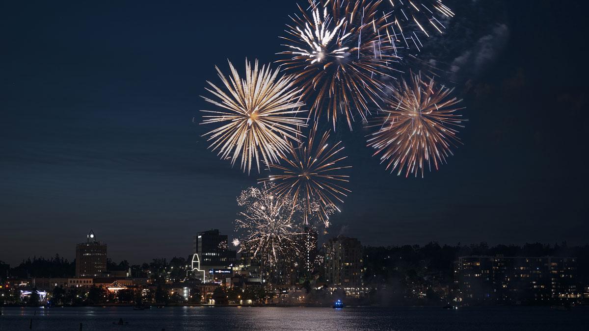 Colourful fireworks over Kempenfelt Bay with the downtown skyline in the background