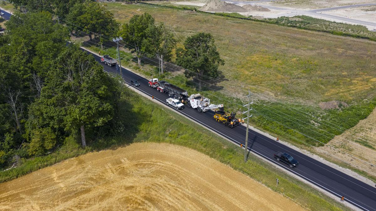 Aerial view of asphalt paving taking place