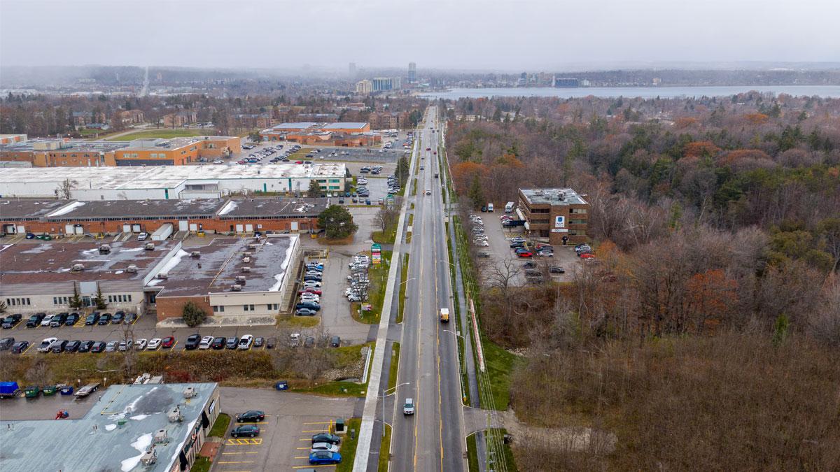 Aerial view of Bayview Drive widened to include one northbound lane, one southbound lane and a two-way left turn lane in the centre