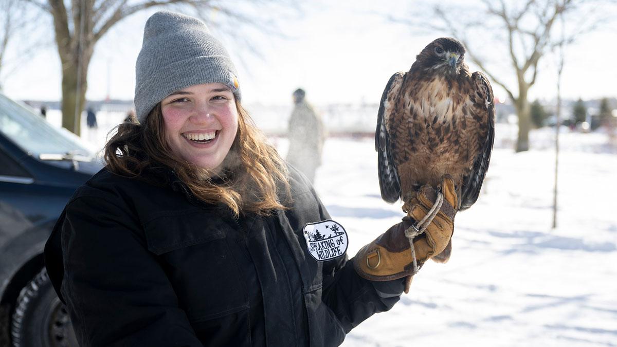 Person holding a bird