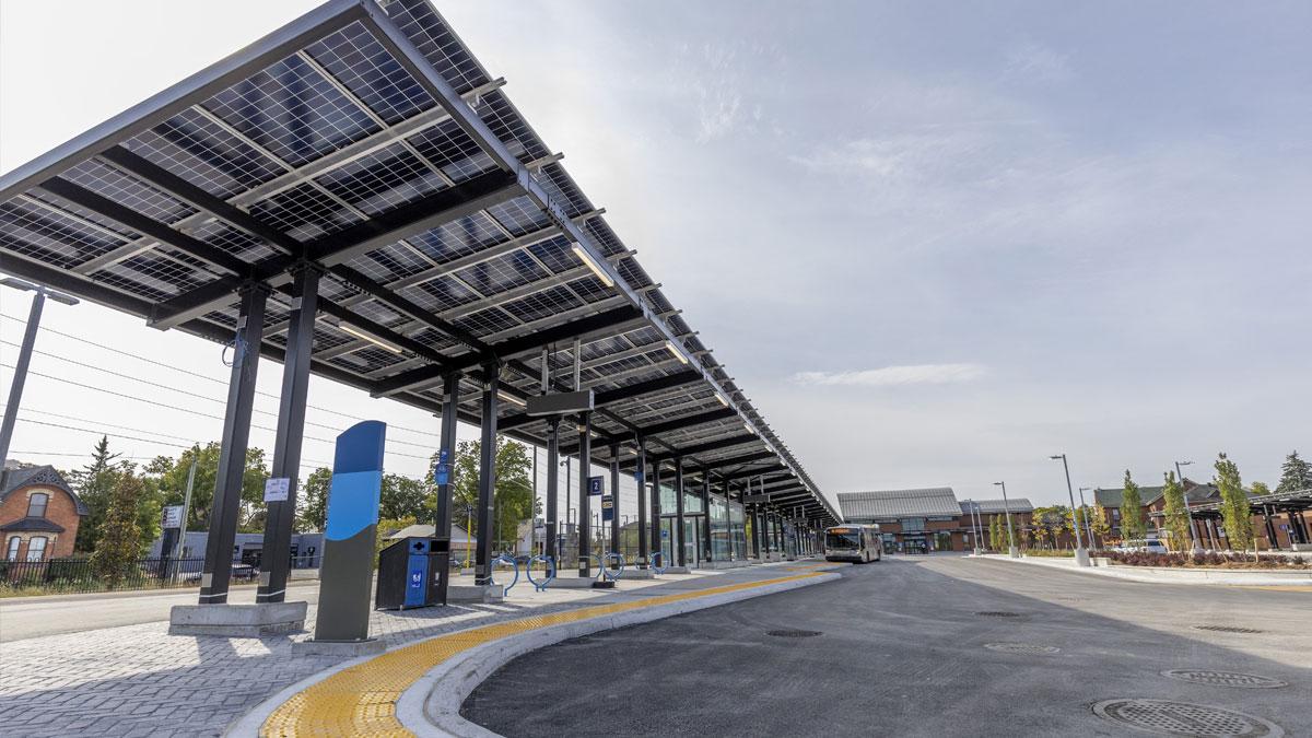 Covered bus station with solar panels.