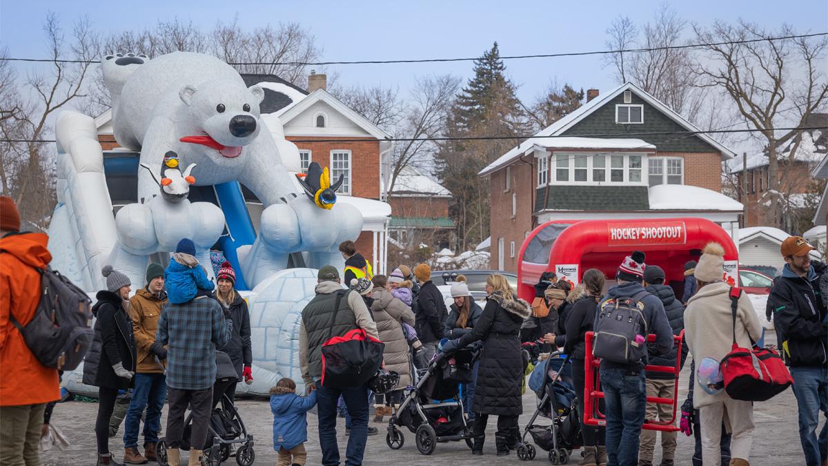 Crowd gathered near a large inflatable polar bear at the City's Family Day Celebrations.