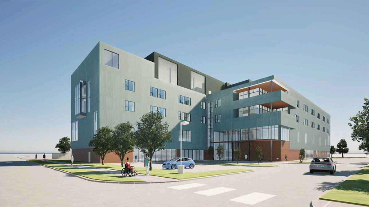 Modern multi-story building with green facade and landscaped outdoor area.