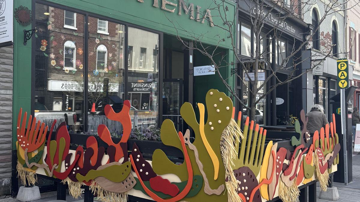 Bohemia patio with colourful artwork composed of layered organic forms.
