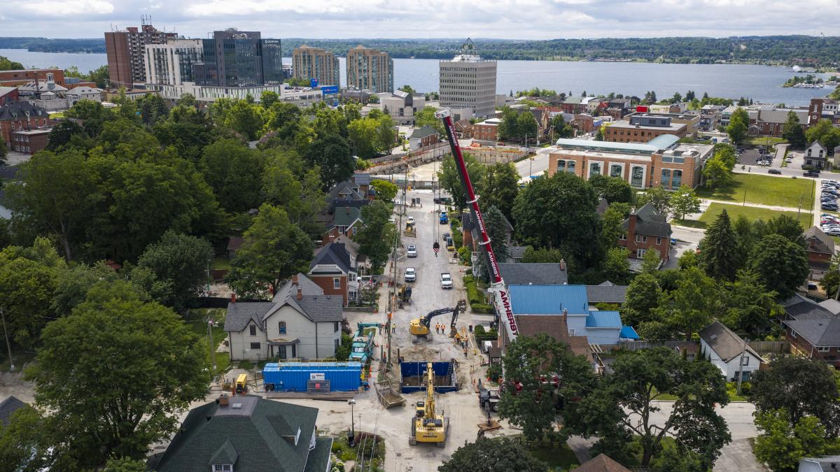 Aerial view of Owen Street under construction, with machinery and a large crane visible.