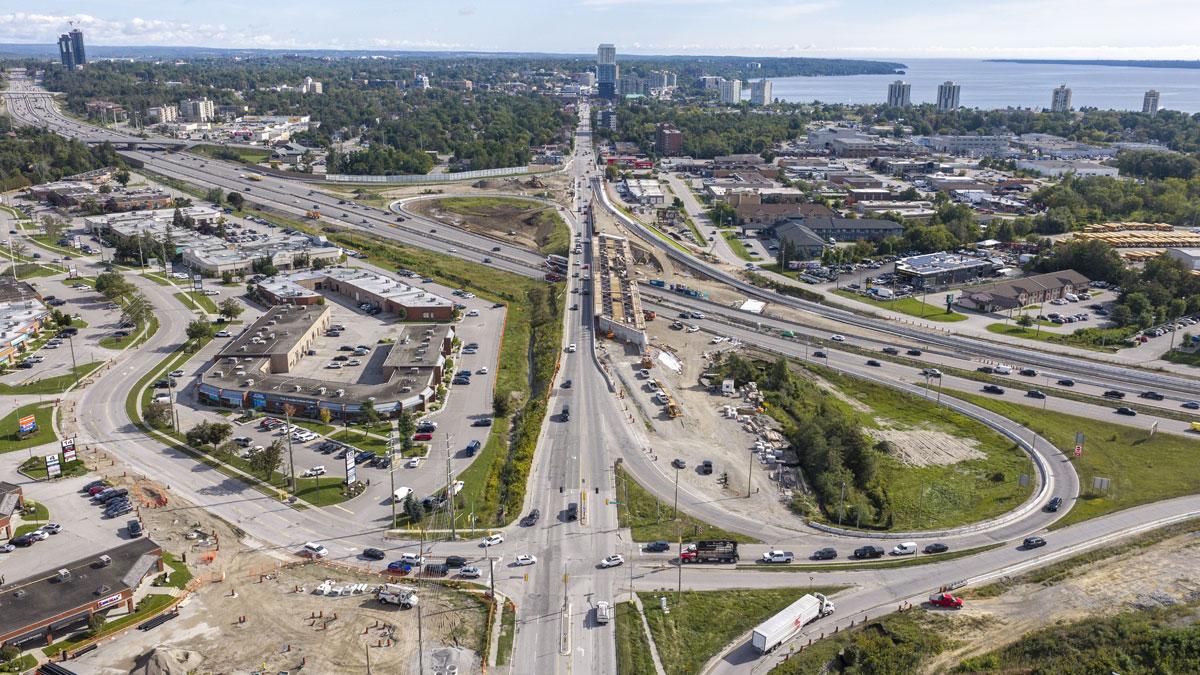 Aerial view of a busy highway interchange under construction.