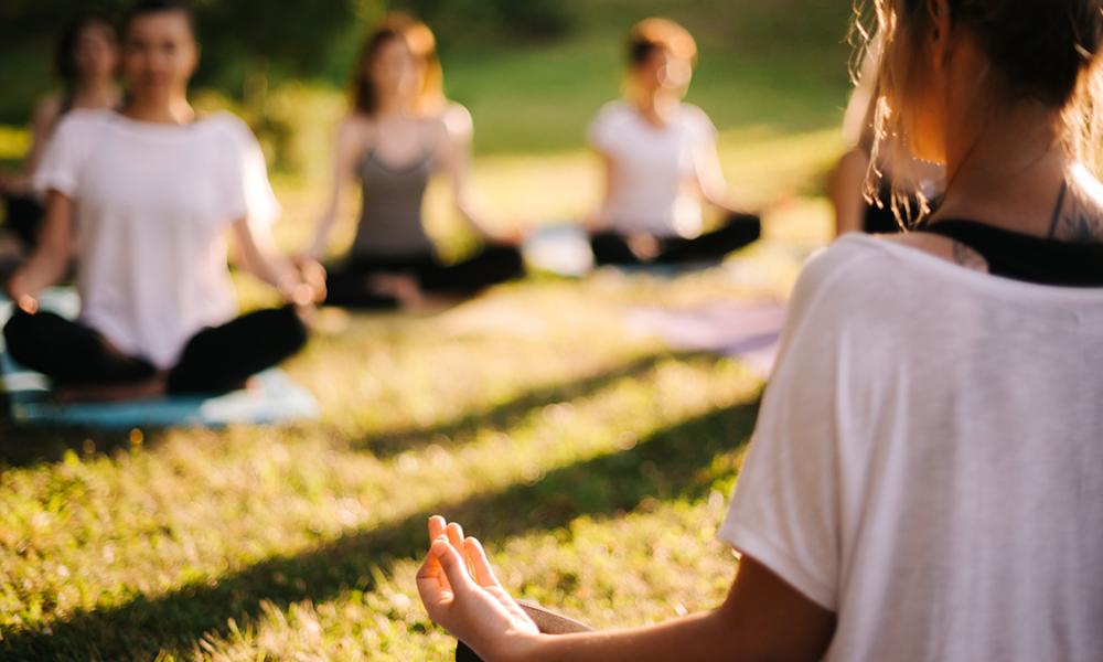 people doing yoga outdoors